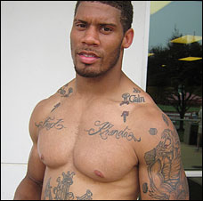 A shirtless and tattooed Washington Redskins Safety Laron Landry 
